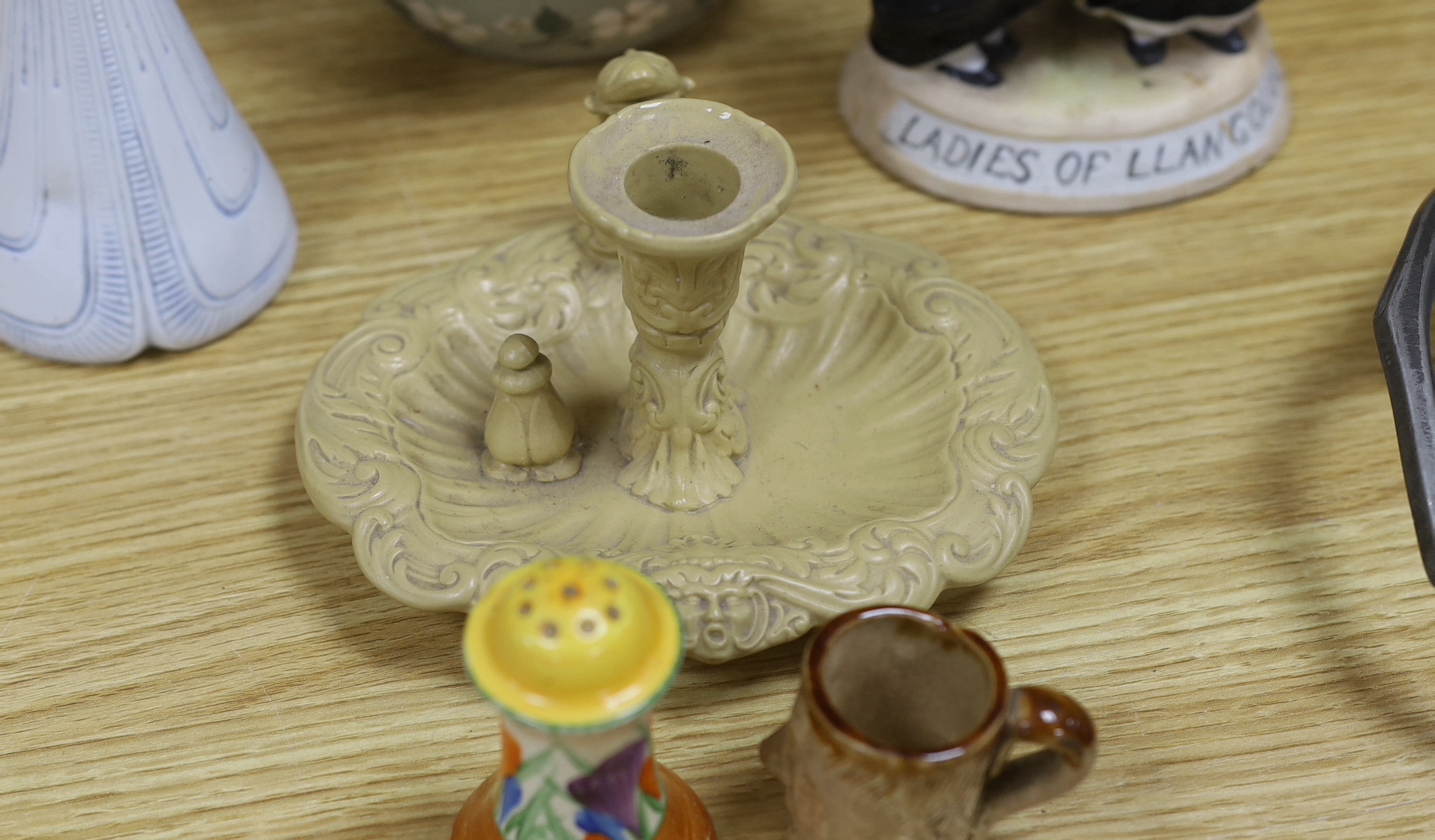 A Royal Doulton mug, two figures and a jar, a Clarice Cliff pepper and four other items (9), tallest Ballon Boy 20cm high